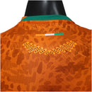 Camisa Costa do Marfim I 26/27 - Jogador Puma Masculina - Laranja com detalhes em verde