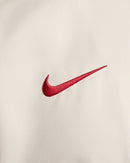 Jaqueta Corta-Vento Liverpool I 24/25 - Masculina Nike - Bege com detalhes em vermelho e preto