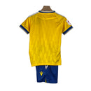 Kit Infantil Cadiz I Macron 23/24 - Amarelo com detalhes em azul