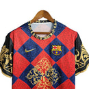 Camisa Barcelona Treino 23/24 - Torcedor Nike Masculina - Grená com detalhes em dourado e preto