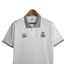 Camisa Real Madrid Polo 23/24 - Torcedor Adidas Masculina - Branca com detalhes em preto